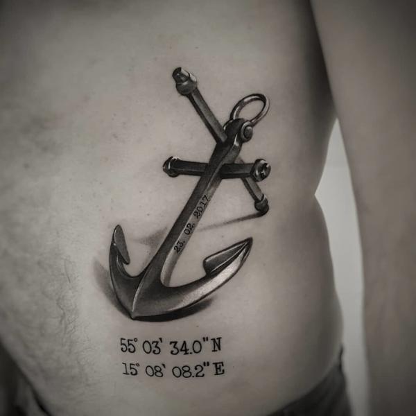 Realistic anchor with coordinates tattoo