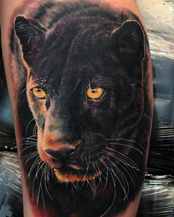 Realistic black panther head tattoo