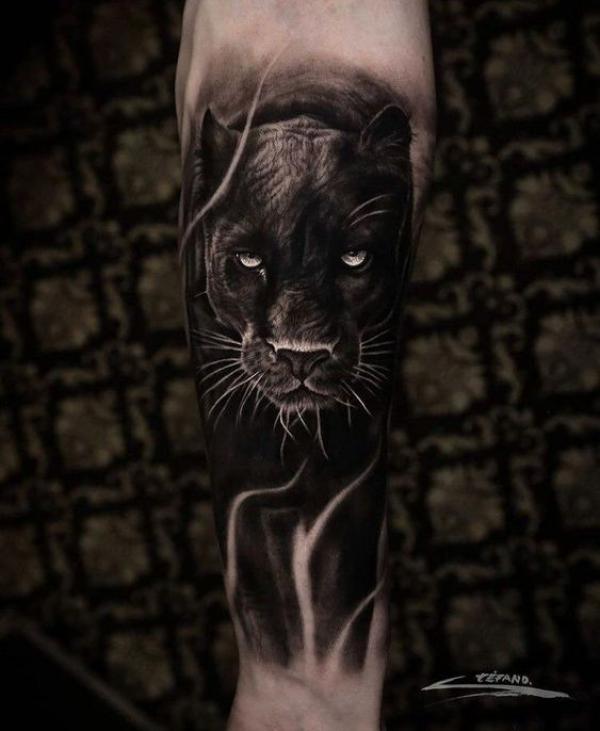 Realistic black panther tattoo forearm