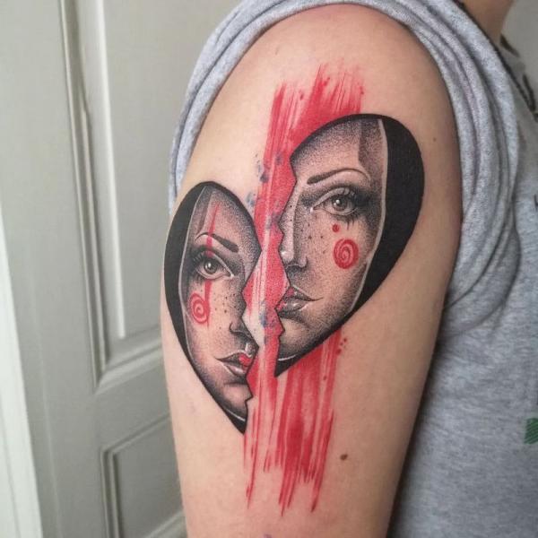 Realistic broken heart face tattoo