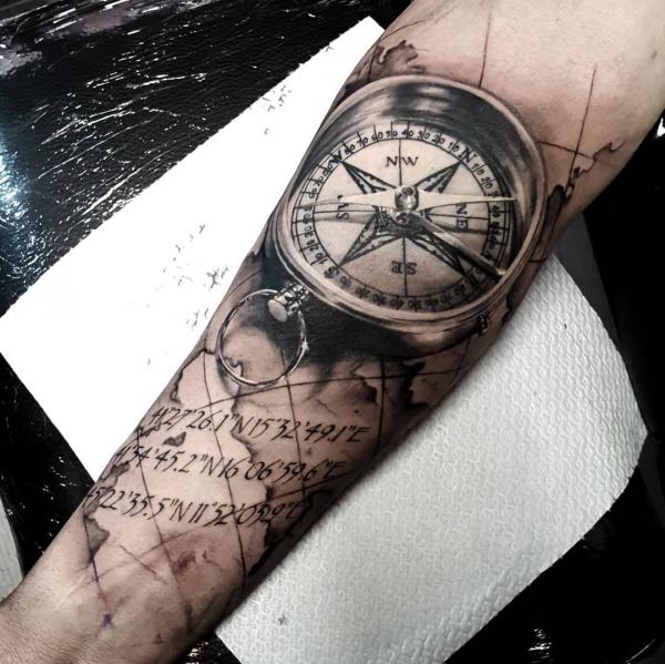 Realistic compass with map and coordinates tattoo