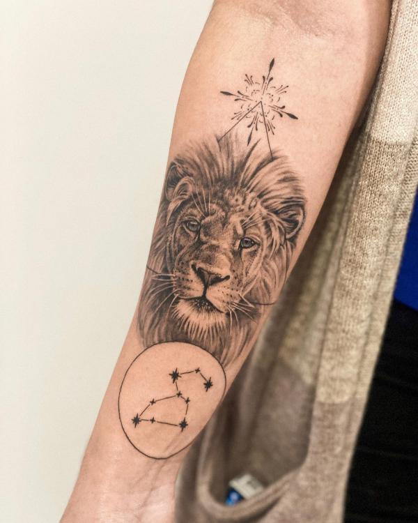 Realistic lion head and Leo constellation tattoo