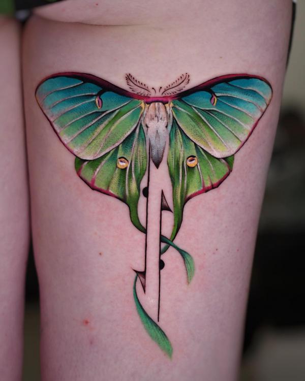 Realistic luna moth back of thigh tattoo