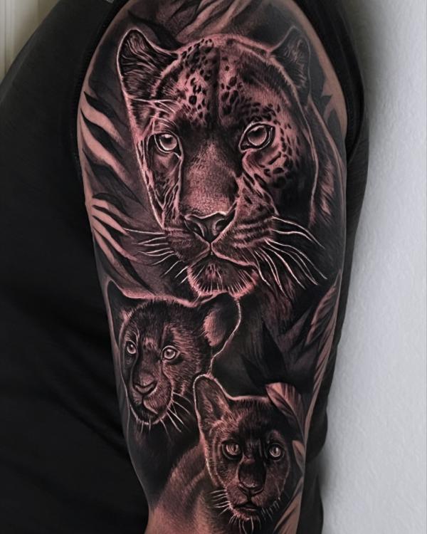 Realistic panther and cub tattoo half sleeve