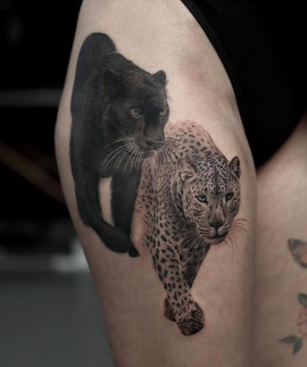 Realistic panther and jaguar tattoo on thigh
