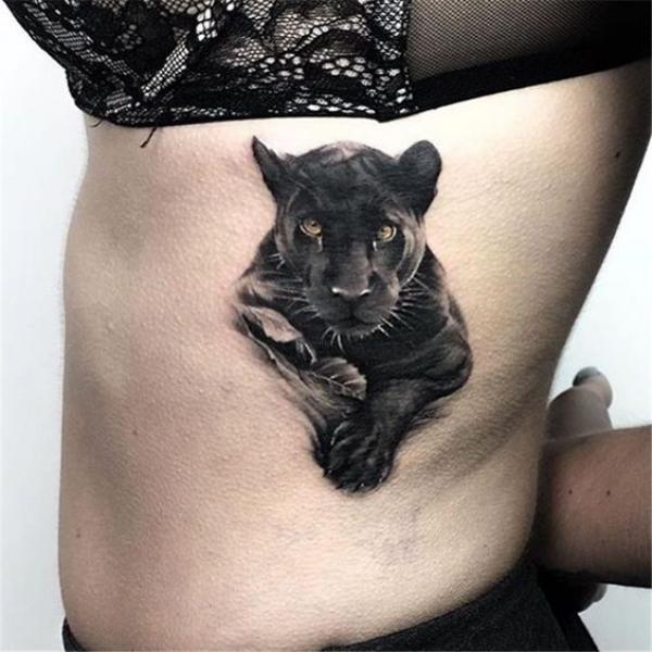 Realistic panther side tattoo