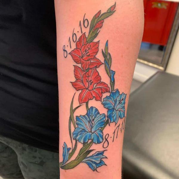 Red and blue gladiolus tattoo with dates