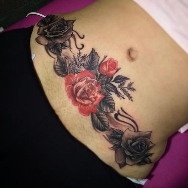 Red and grey roses tummy tattoo
