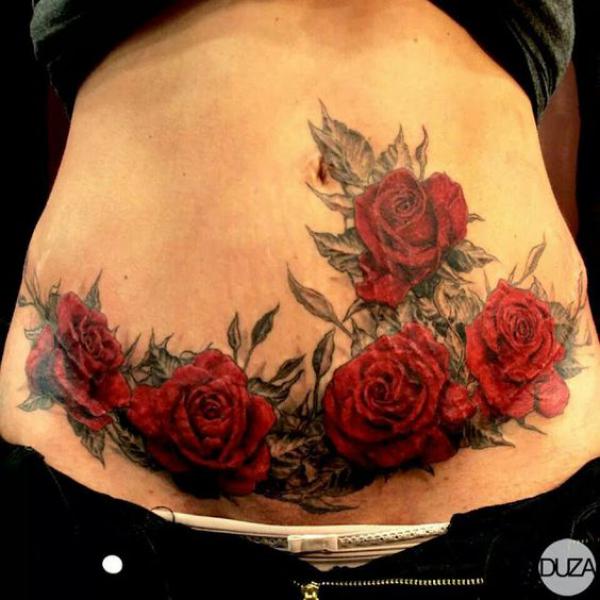 Red roses with greyscale leaves tummy tattoo