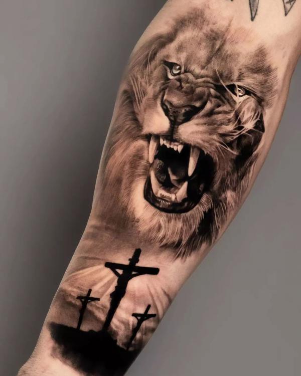 Roaring lion and 3 cross tattoo