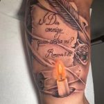 Romans 8 18 tattoo bicep