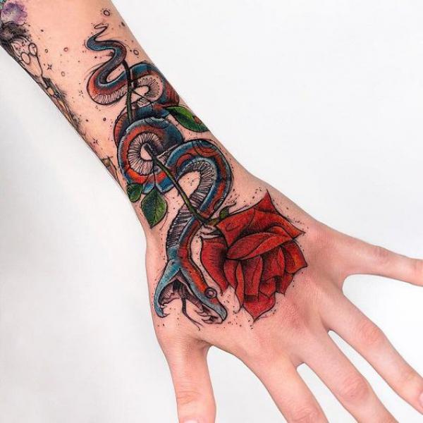Rose and snake wrist to hand tattoo