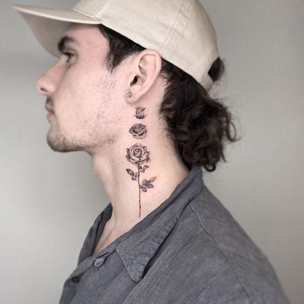 Rose bud to bloom neck tattoo