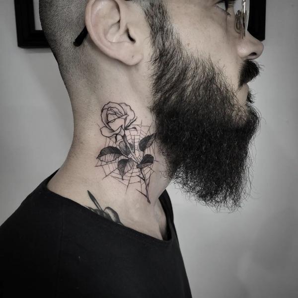 Rose outline with spider web neck tattoo