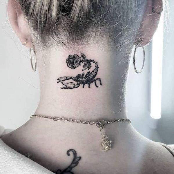 Rose with scorpion neck tattoo