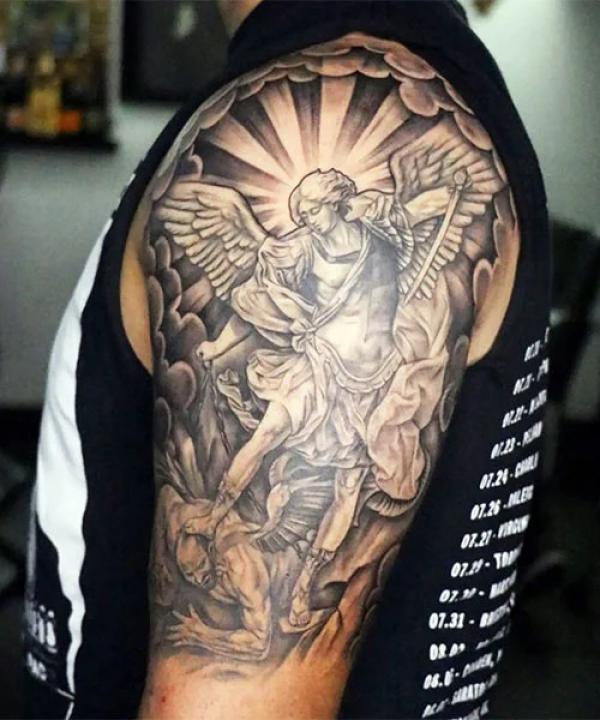 Saint Michael battle with demon half sleeve tattoo
