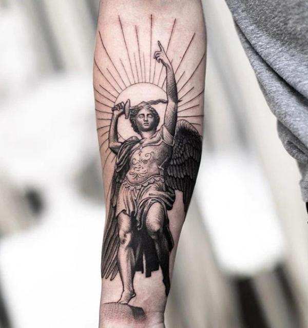 Saint Michael with halo forearm tattoo