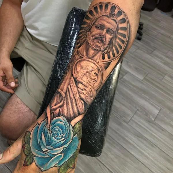 San Judas and blue rose tattoo