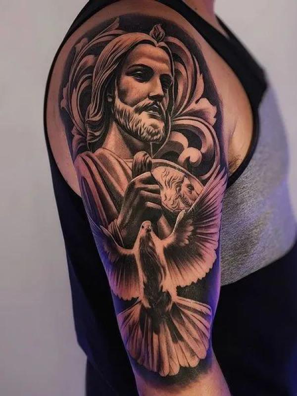 San Judas and dove tattoo half sleeve