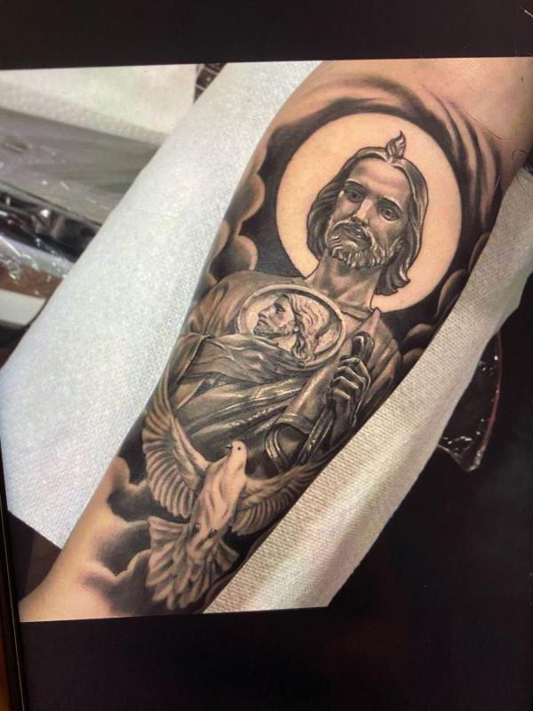 San Judas and dove tattoo