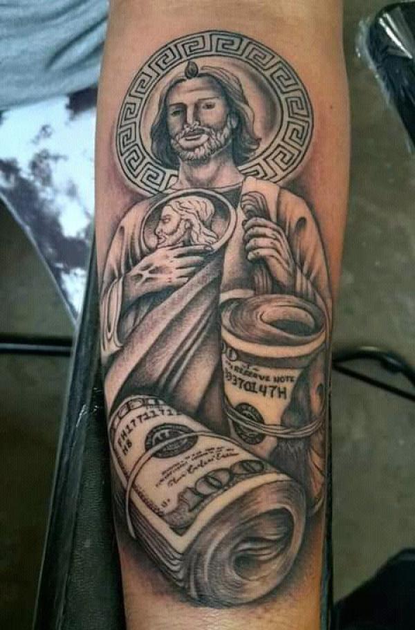 San Judas and money forearm tattoo