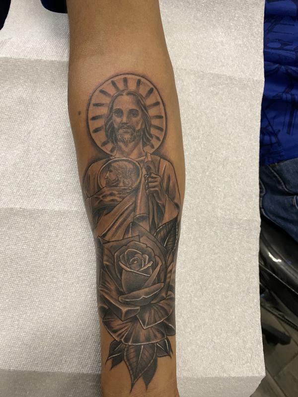 San Judas and rose tattoo