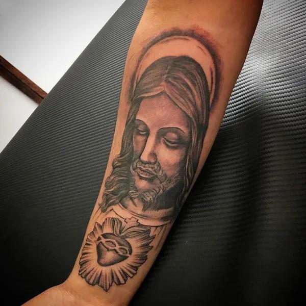 San Judas and sacred heart tattoo