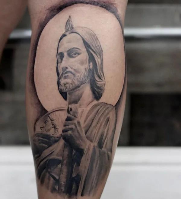 San Judas calf tattoo