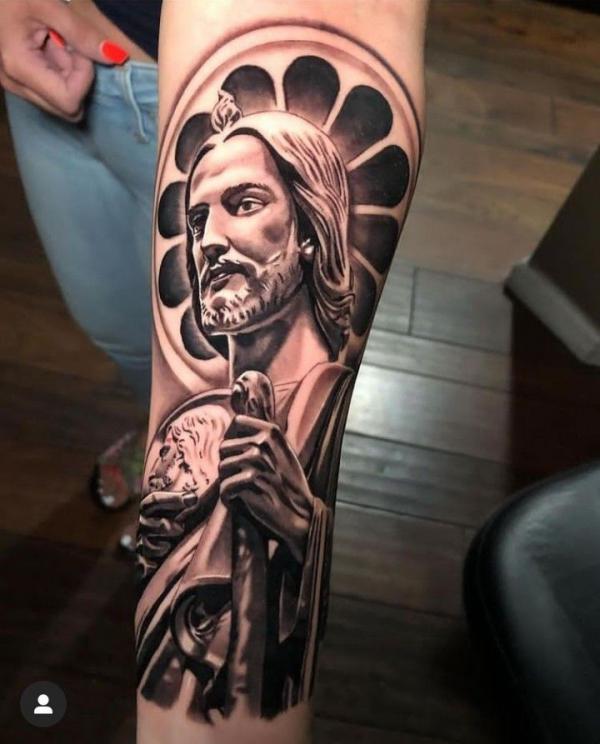 San Judas inner forearm tattoo