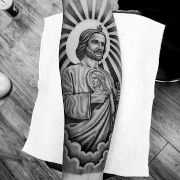 San Judas with halo in clouds tattoo