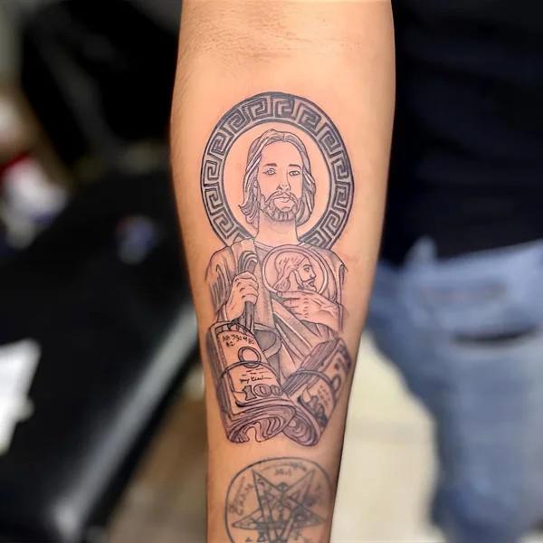 San Judas with money inner forearm tattoo