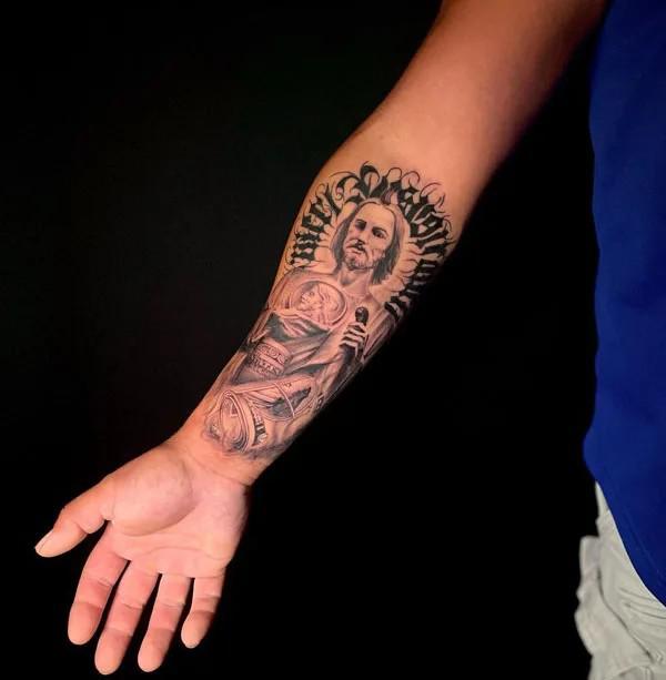 San Judas with mony quarter sleeve tattoo
