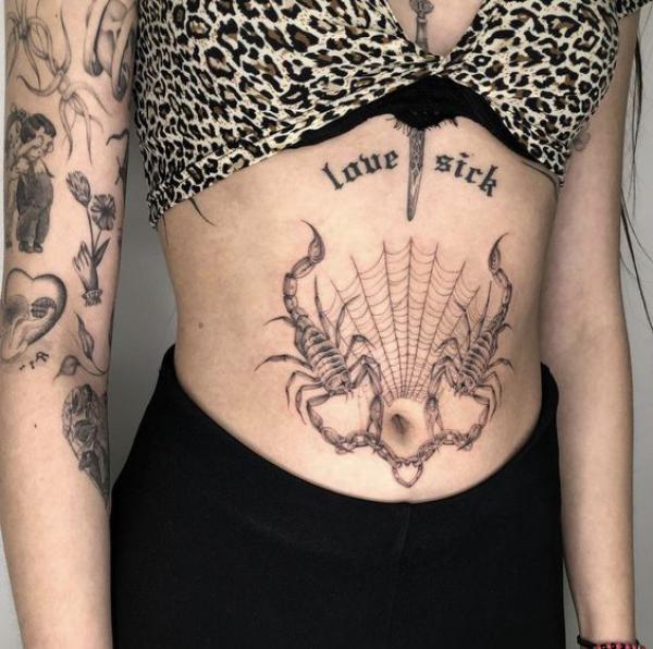 Scorpion and spider web tummy tattoo