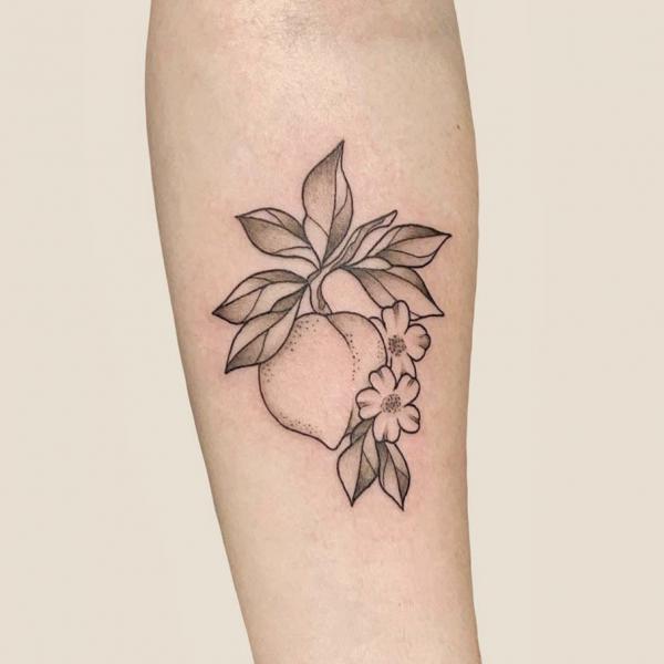 Simple peach with leaves and flowers tattoo