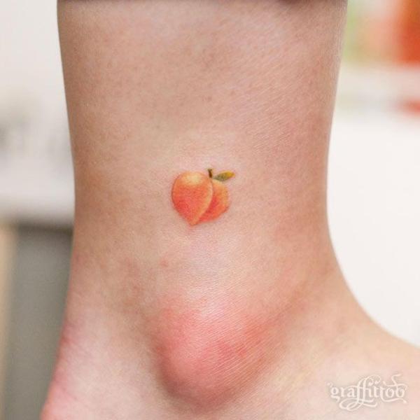 Single peach ankle tattoo
