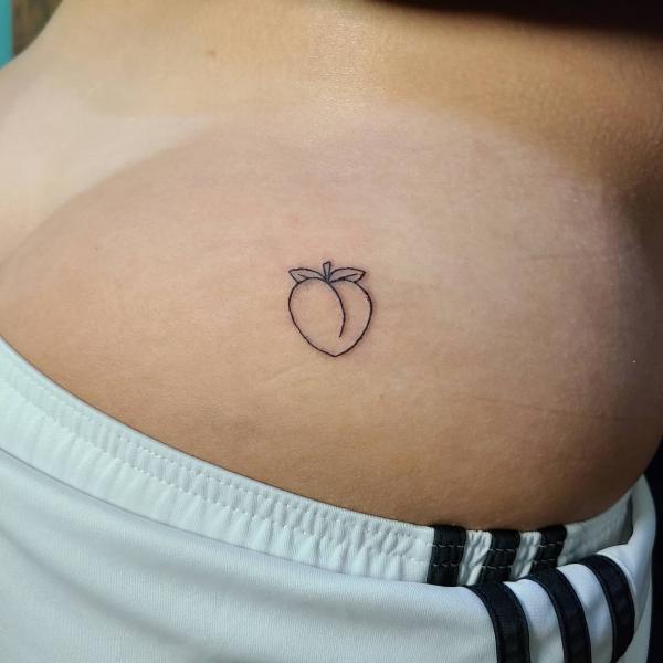 Single peach outline tattoo