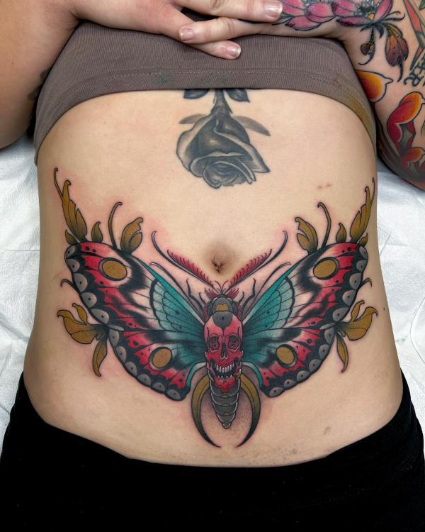 Skull moth stomach tattoo