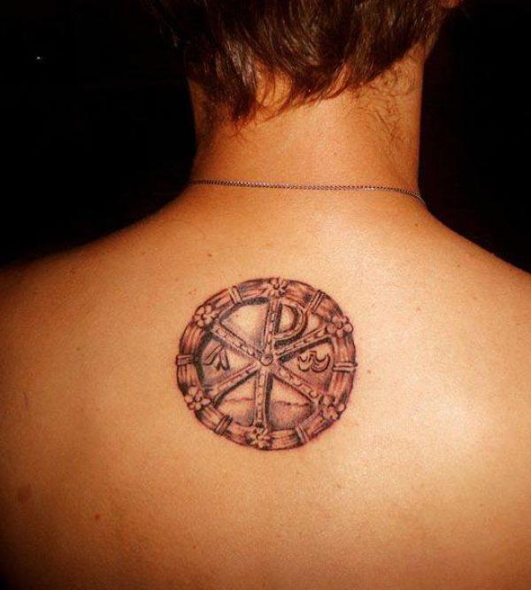 Small Chi Rho upper back tattoo
