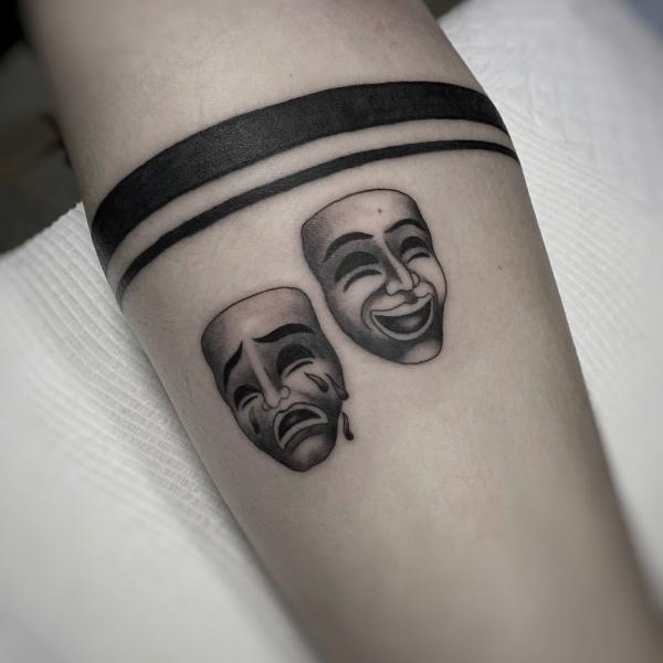 Small Laugh Now Cry Later with armband tattoo