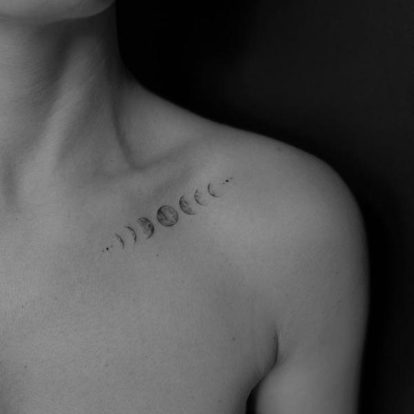 Small Moon phases clavicle tattoo