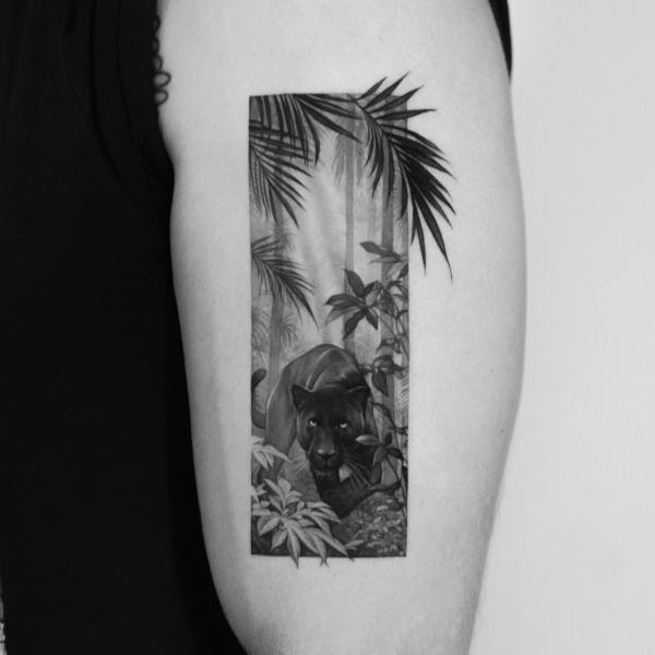 Small black panther rectangular tattoo on upper arm