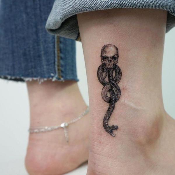 Small death eater ankle tattoo