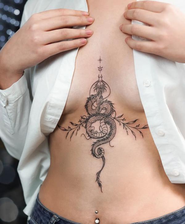 Small dragon stomach tattoo