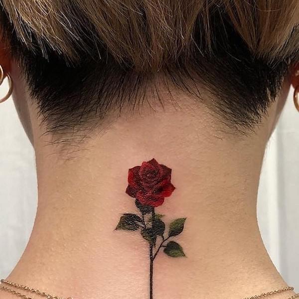 Small rose nape tattoo