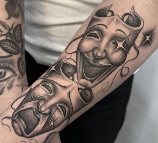 Smile now cry later arm tattoo