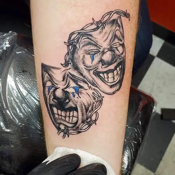 Smile now cry later with barbed wire tattoo