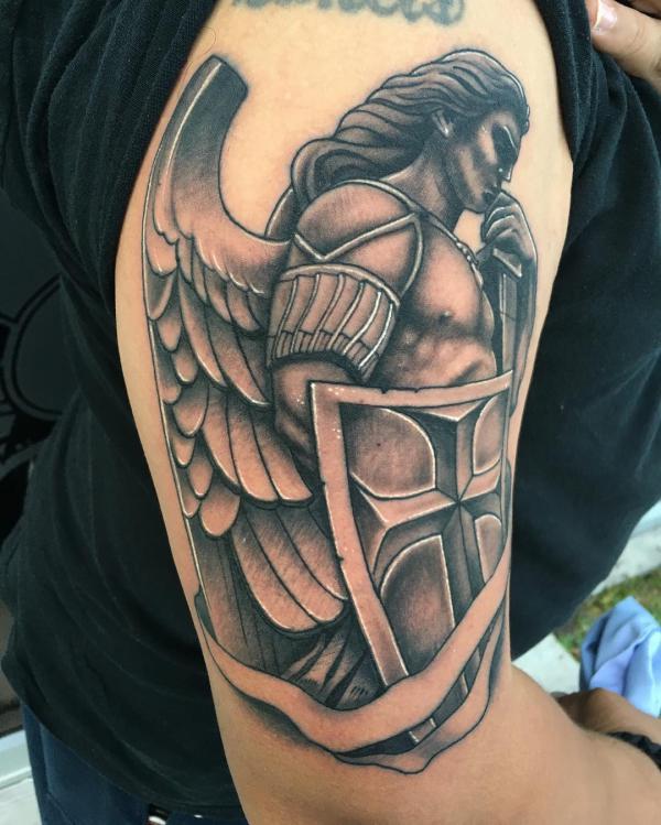 St Michael with shield and sword half sleeve tattoo
