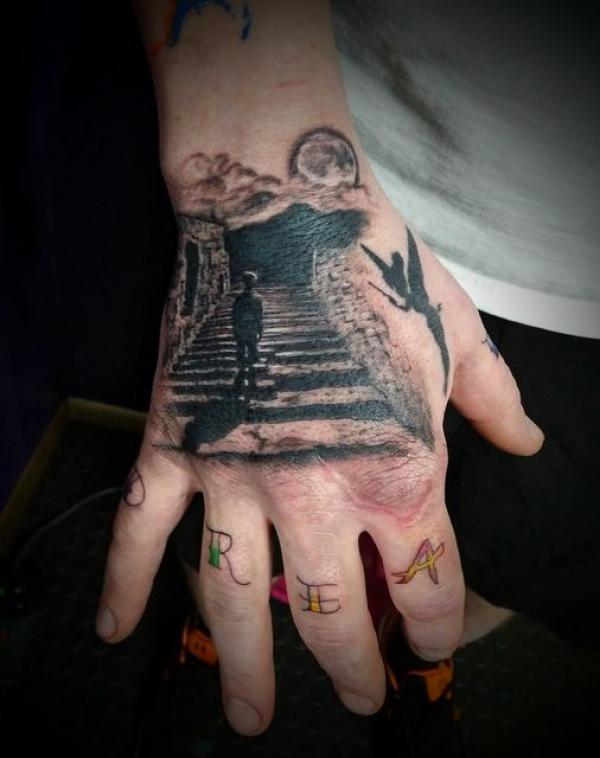 Staircase to heaven hand tattoo