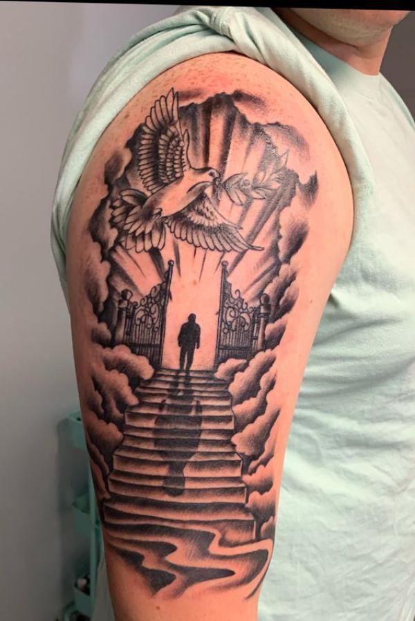 Staircase to heaven with a bird holding grass flying above tattoo