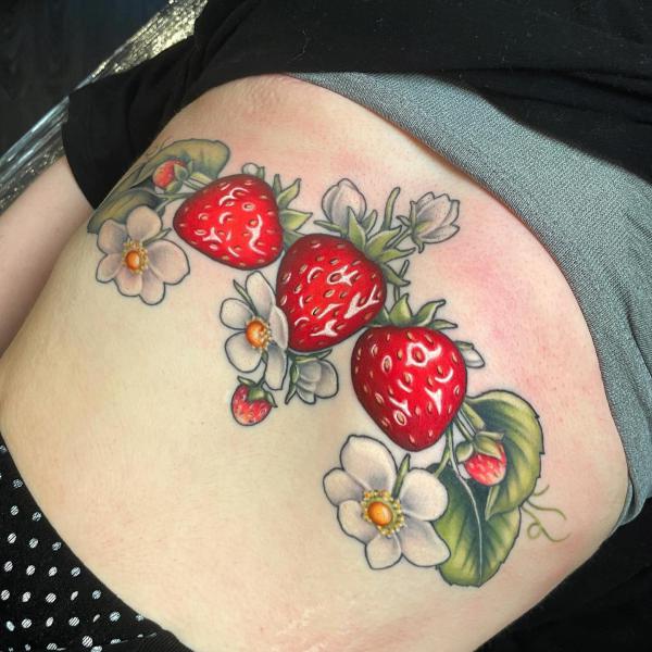 Strawberry with flowers stomach tattoo